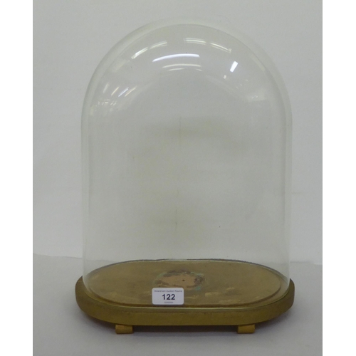 122 - A clear glass oval display dome, on a gilded platform  16