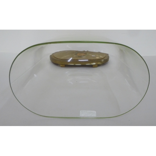 122 - A clear glass oval display dome, on a gilded platform  16