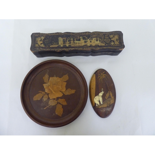 123 - A mixed lot: to include an early 20thC Chinese black lacquered and git painted fan box, decorated wi... 