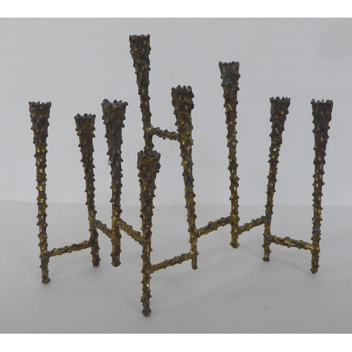 124 - A 1970s 'brutalist' brass menorah in the style of Paul Evans  8