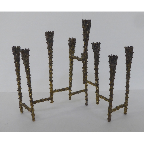 124 - A 1970s 'brutalist' brass menorah in the style of Paul Evans  8