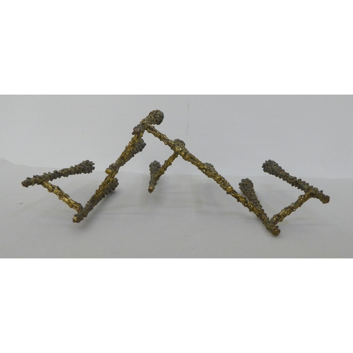 124 - A 1970s 'brutalist' brass menorah in the style of Paul Evans  8