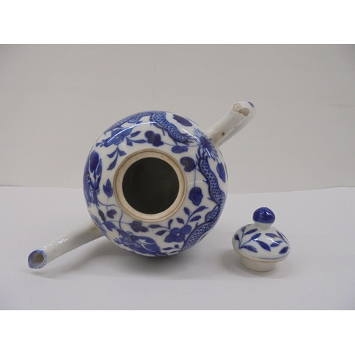 128 - Three Chinese porcelain teapots of similar form, decorated in blue and white