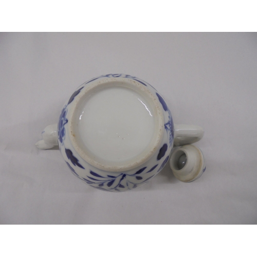 128 - Three Chinese porcelain teapots of similar form, decorated in blue and white