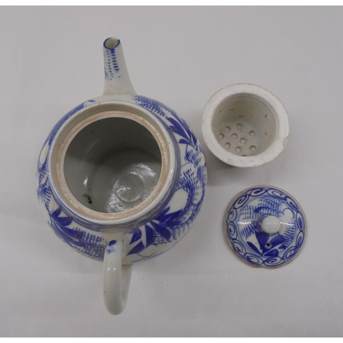 128 - Three Chinese porcelain teapots of similar form, decorated in blue and white