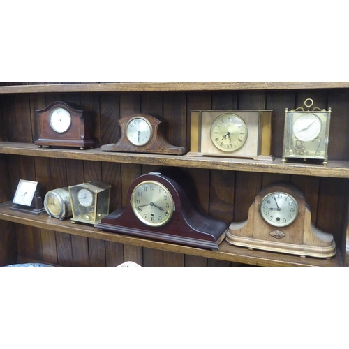 147 - Mainly early/mid 20thC clocks and mantel timepieces: to include a 1940s Napoleon's hat design, mahog... 