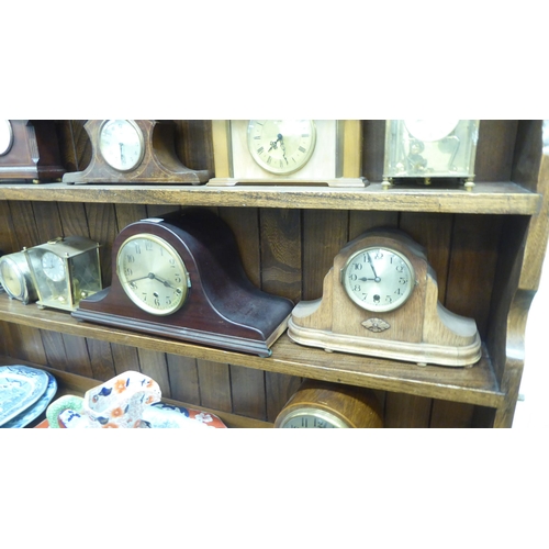 147 - Mainly early/mid 20thC clocks and mantel timepieces: to include a 1940s Napoleon's hat design, mahog... 