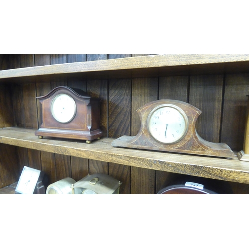 147 - Mainly early/mid 20thC clocks and mantel timepieces: to include a 1940s Napoleon's hat design, mahog... 