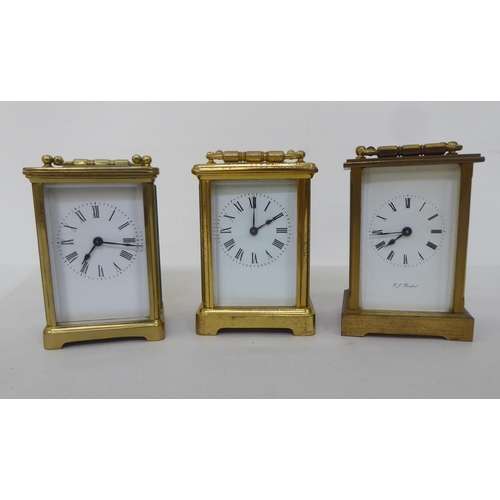 161 - Three lacquered brass carriage timepieces, each faced by a Roman dial  4.5