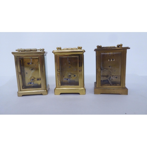 161 - Three lacquered brass carriage timepieces, each faced by a Roman dial  4.5