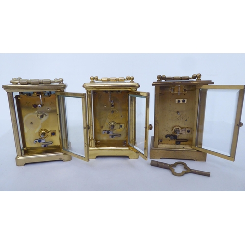 161 - Three lacquered brass carriage timepieces, each faced by a Roman dial  4.5