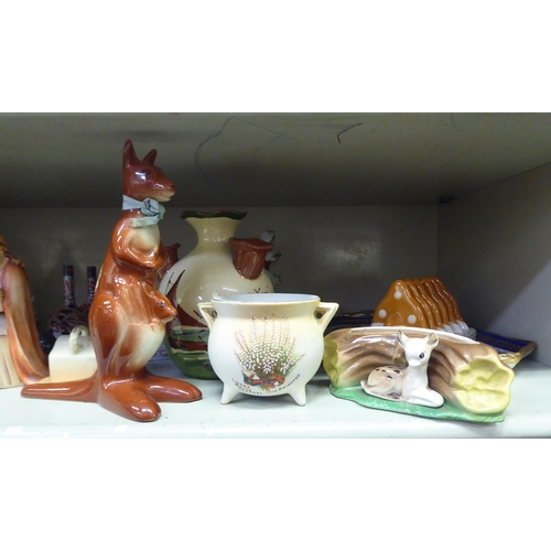 163 - Decorative ceramics: to include a Poole pottery model, a rabbit  2.5