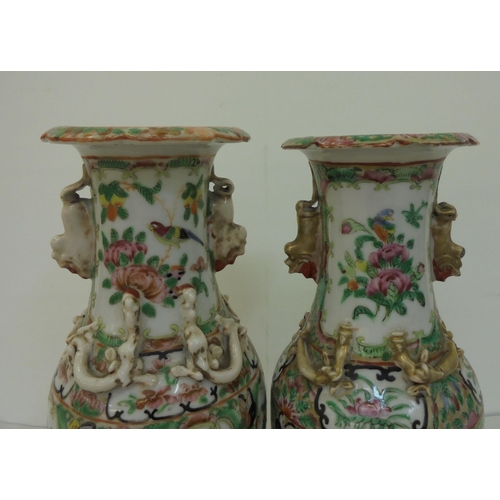 164 - Two similar Chinese Canton Export porcelain vases with overlaid ornament, decorated in panels with s... 