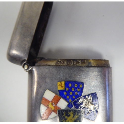 116 - A late Victorian silver and coloured enamel vesta case of rectangular design, incorporating four fla... 