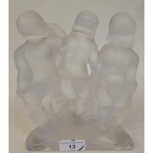 13 - A Lalique 'Luxembourg' frosted crystal cherub trio group, on a semi-circular plinth  bears an etched... 