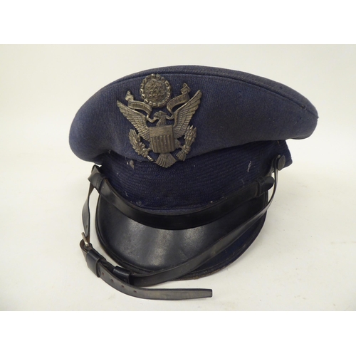 39 - Three items of military headgear, viz. a peaked Moby cap; an American Air Force peaked cap; and an e... 