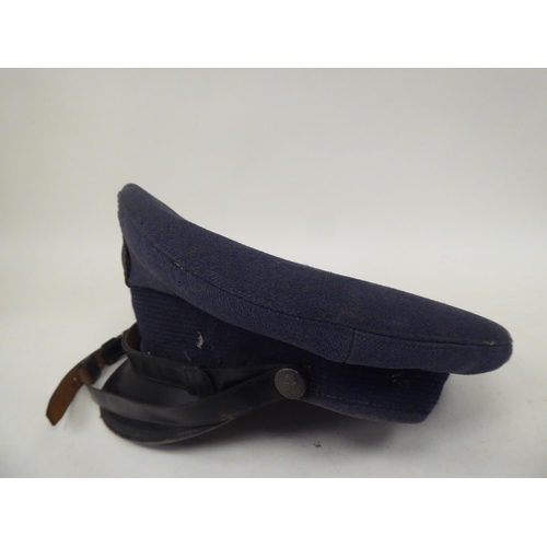 39 - Three items of military headgear, viz. a peaked Moby cap; an American Air Force peaked cap; and an e... 