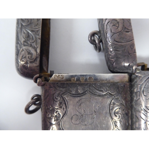 46 - Three similar late Victorian silver vesta cases of rectangular design with hinged caps, incorporatin... 