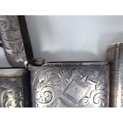 46 - Three similar late Victorian silver vesta cases of rectangular design with hinged caps, incorporatin... 