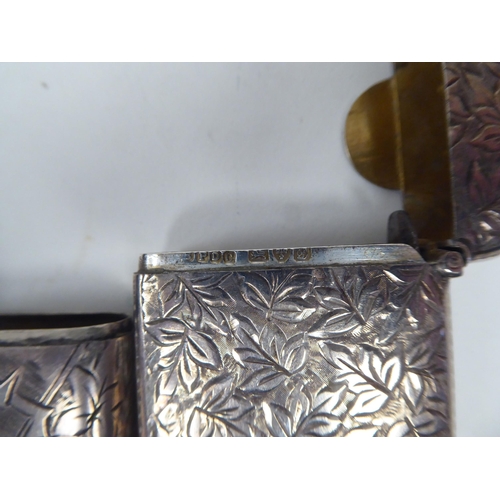 46 - Three similar late Victorian silver vesta cases of rectangular design with hinged caps, incorporatin... 