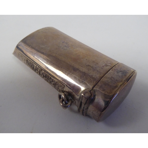 68 - A late Victorian silver novelty vesta case, fashioned as a pea whistle with a hinged cap, strike pla... 