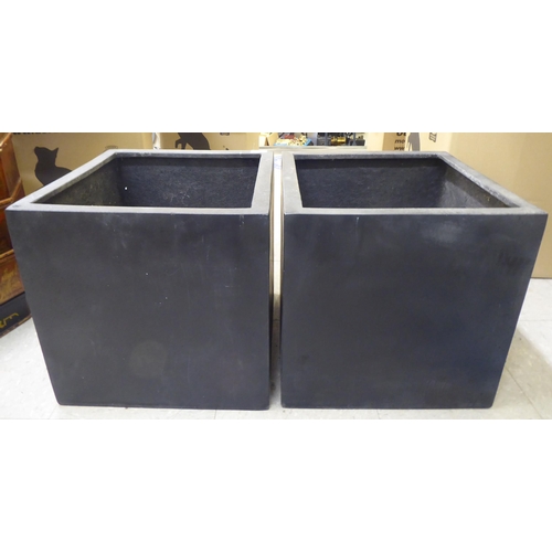 103 - A pair of modern black composition planters  15