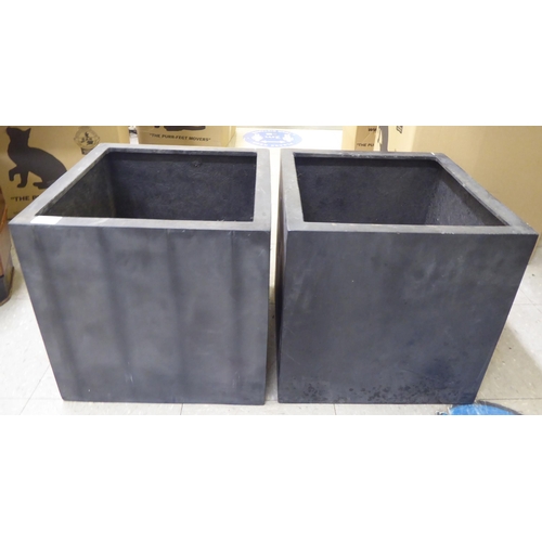 104 - A pair of modern black composition planters  15