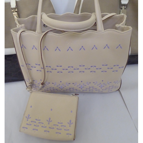 118 - A Gucci holdall and matching handbag in fawn and cream canvas with dust cover; and a Anya Hindmarch ... 