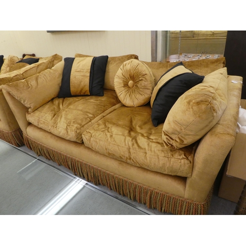 123 - A modern box settee with a low back and enclosed arms, upholstered in tasselled old gold coloured fa... 