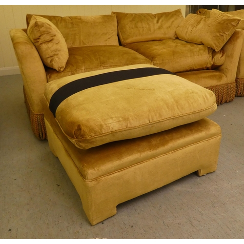 124 - A modern box settee with a low back and enclosed arms, upholstered in tasselled old gold coloured fa... 