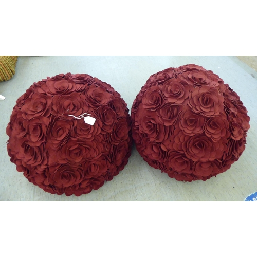 136 - A pair of novelty floral design burgundy coloured floor cushions 