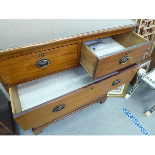 137 - A 19thC mahogany dressing chest,  comprising two short/three long drawers, raised on bracket feet  4... 