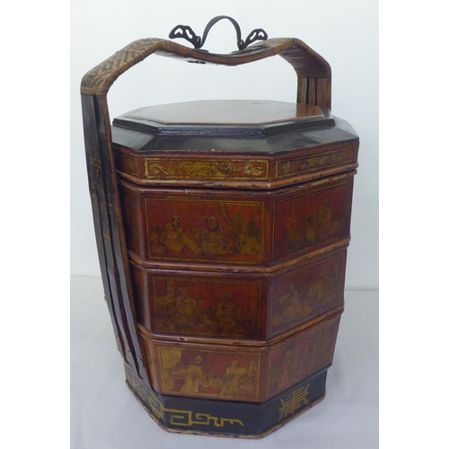 142 - A modern Chinese black lacquered and gilded octagonal four part food carrier  26