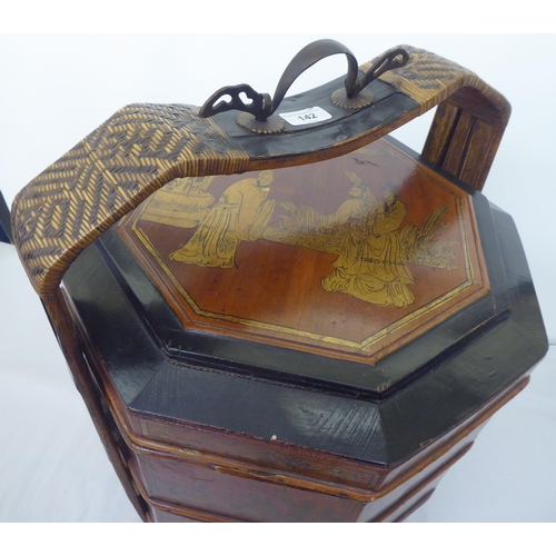 142 - A modern Chinese black lacquered and gilded octagonal four part food carrier  26