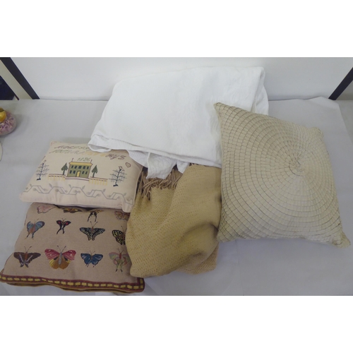 143 - Various cushions, throws and table linen 