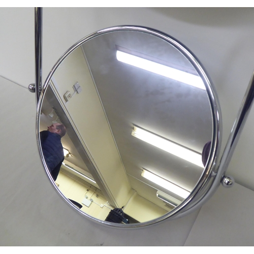 144 - An OMIK double plate tubular metal framed, combination, pivoting bathroom and shaving mirror  23