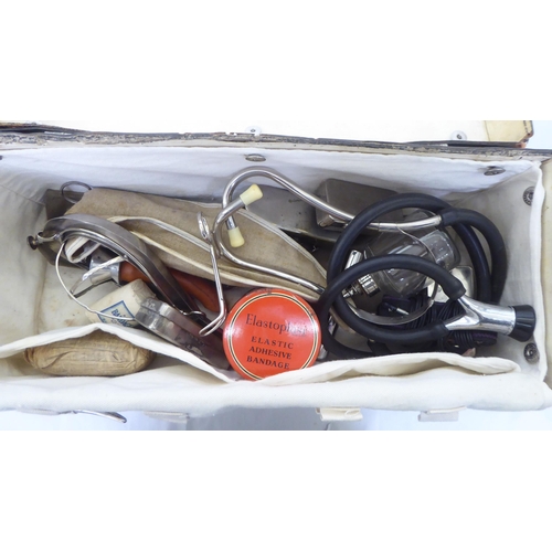 160 - Medical equipment: to include a Mayer & Phelps brown hide case with a fitted interior and access... 