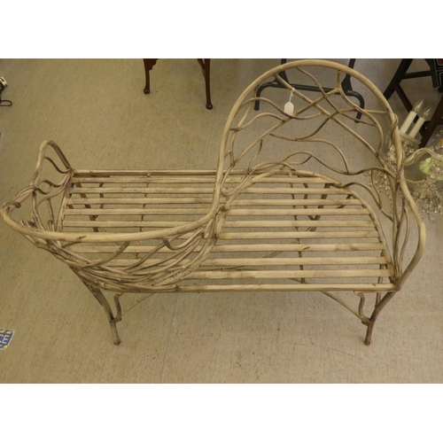 186 - A painted shabby-chic steel wire framed tête-à-tête 'lovers' seat with organically decorated backs