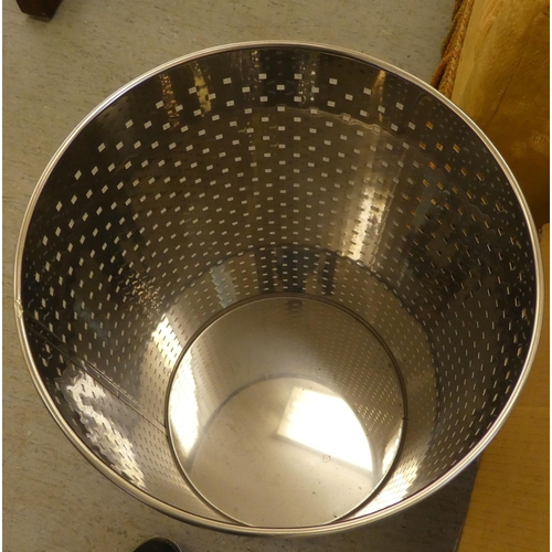 192 - A ventilated steel cylindrical linen bin and cover  24