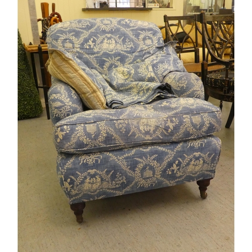 193 - A Victorian style bedroom armchair with printed blue and white patterned upholstered and a cushioned... 