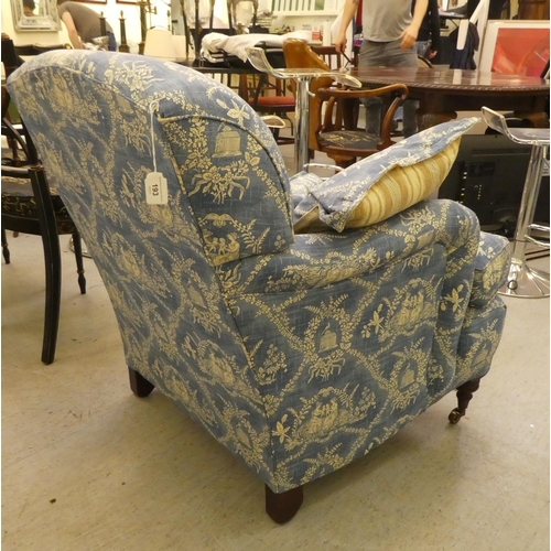 193 - A Victorian style bedroom armchair with printed blue and white patterned upholstered and a cushioned... 