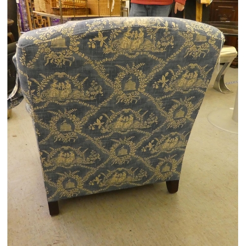 193 - A Victorian style bedroom armchair with printed blue and white patterned upholstered and a cushioned... 