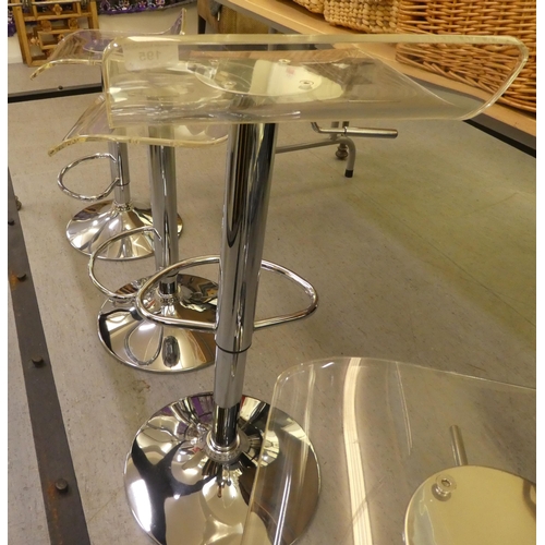 195 - A set of four modern chromium plated, height adjustable bar stools with clear perspex seats 