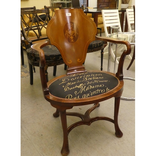 197 - An Edwardian style mahogany and marquetry elbow chair with a solid back and open arms, the upholster... 