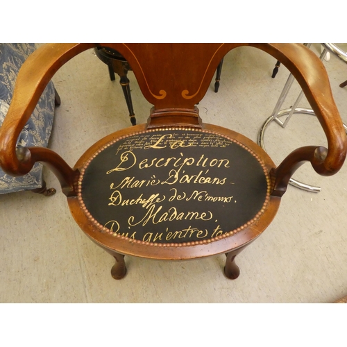 197 - An Edwardian style mahogany and marquetry elbow chair with a solid back and open arms, the upholster... 