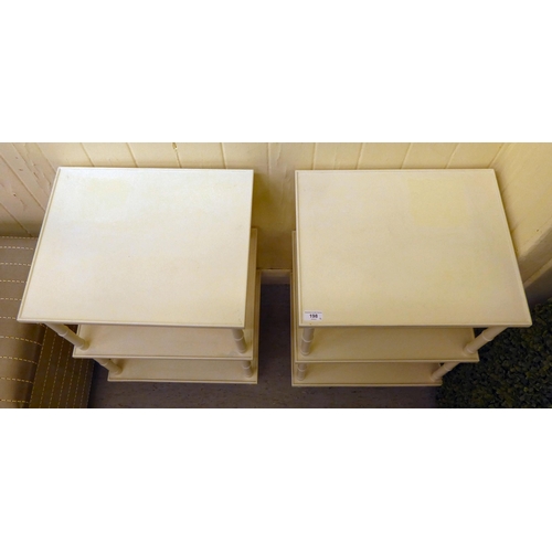 198 - A pair of modern white painted three tier side tables, raised on simulated bamboo uprights  25