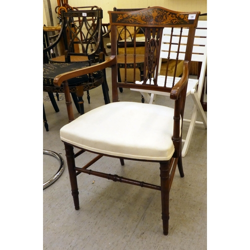 199 - An Edwardian mahogany and marquetry framed side chair with a decorative crest and carved splat, open... 