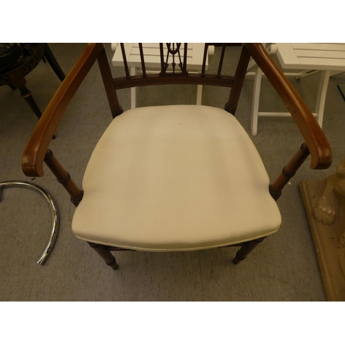 199 - An Edwardian mahogany and marquetry framed side chair with a decorative crest and carved splat, open... 