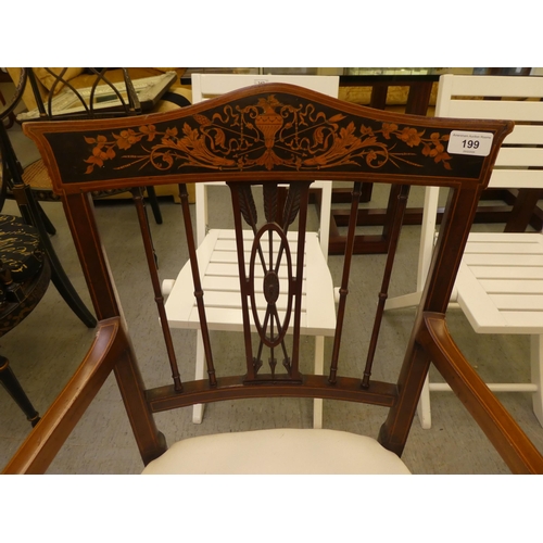 199 - An Edwardian mahogany and marquetry framed side chair with a decorative crest and carved splat, open... 