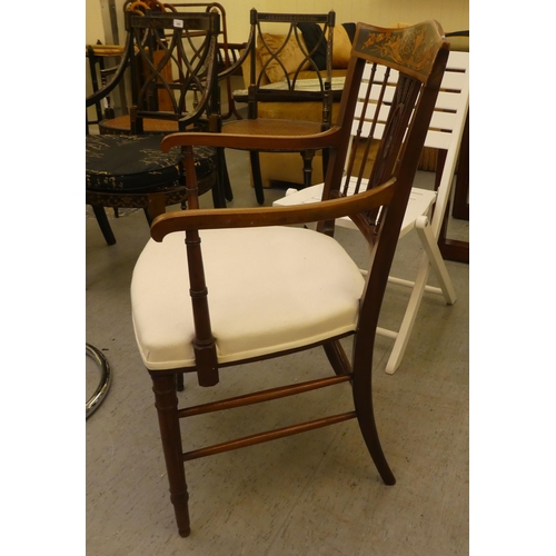 199 - An Edwardian mahogany and marquetry framed side chair with a decorative crest and carved splat, open... 